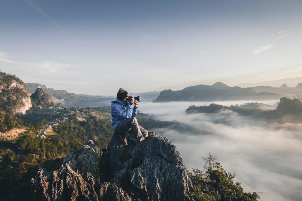 landscape photographer on top of a mountain